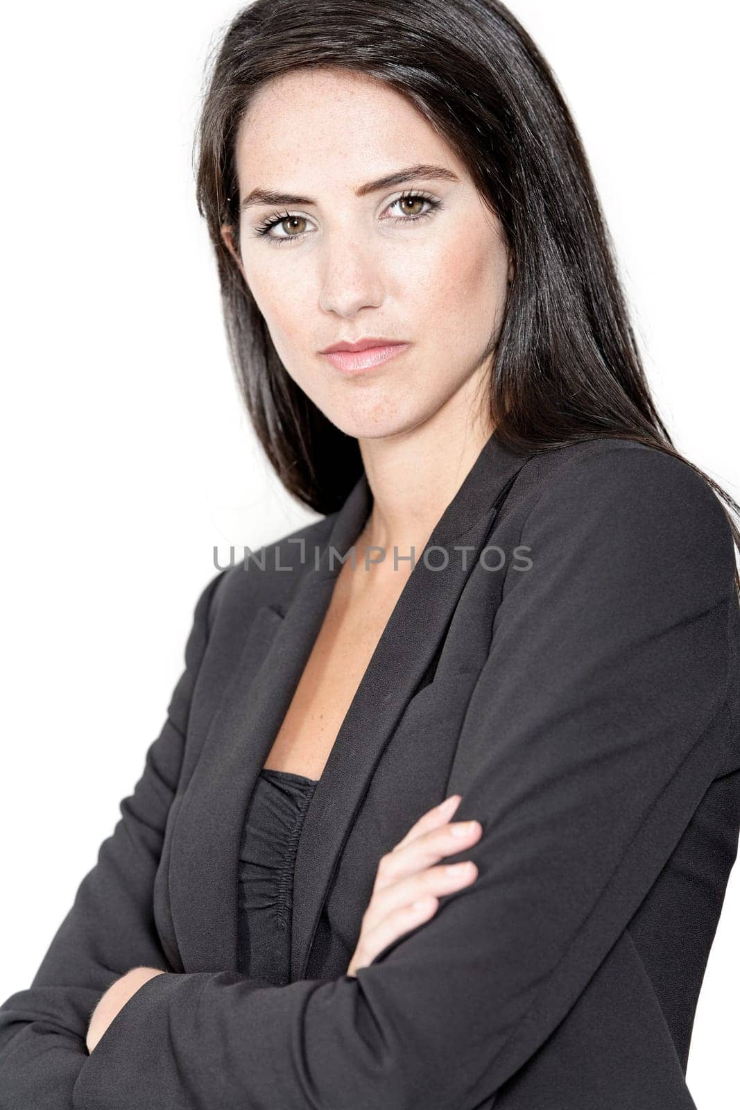 Professional working woman in corporate business clothes with a serious look