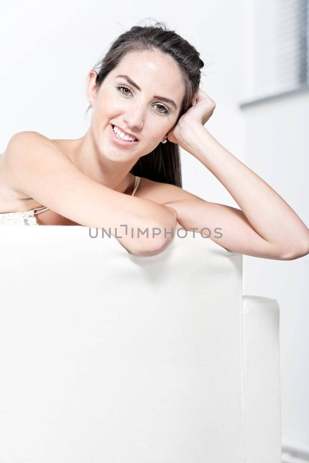 Sexy young woman in cream underwear