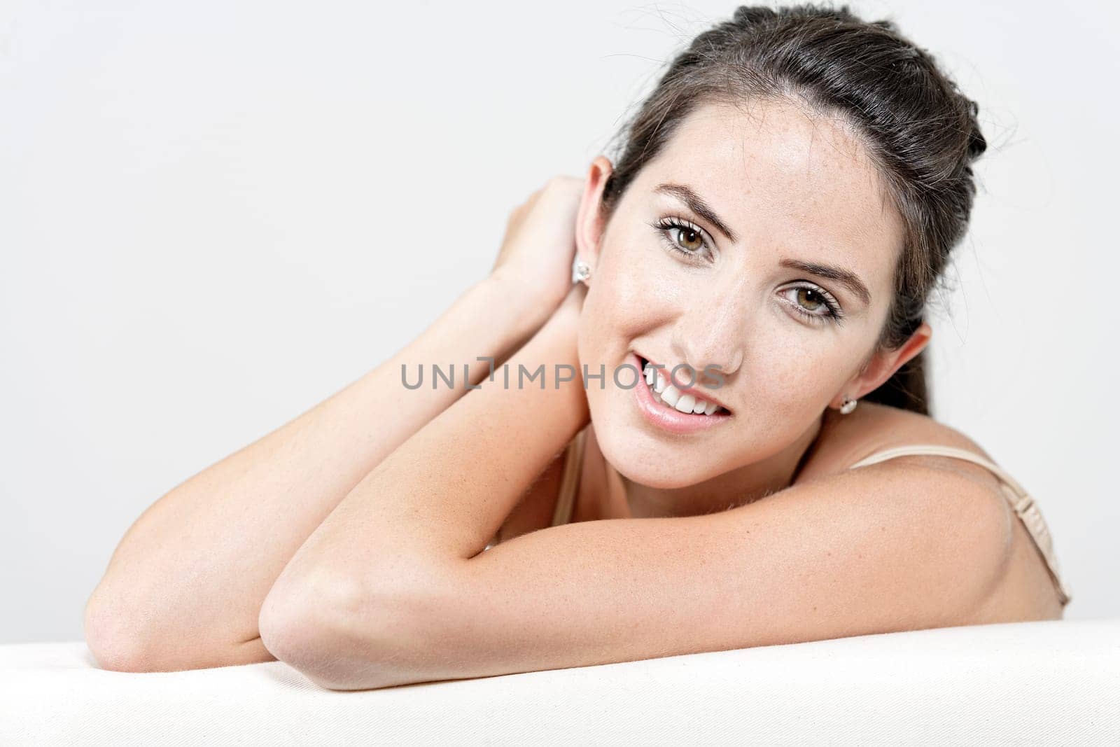 Sexy young woman in cream underwear