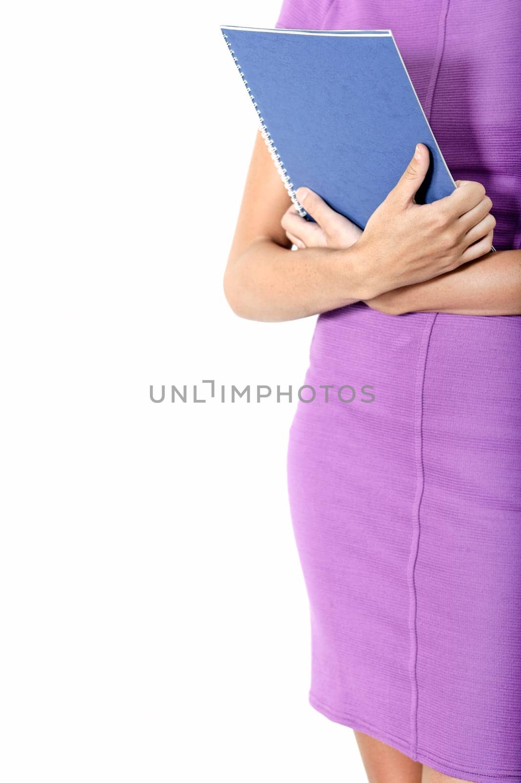 Professional business woman holding blue folders in a purple smart dress