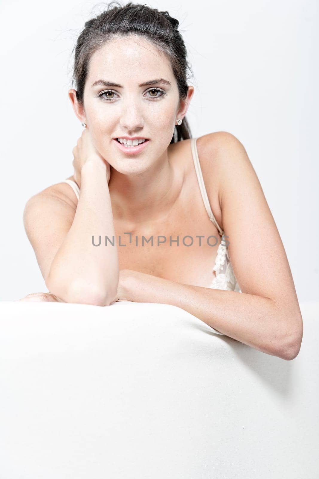 Sexy young woman in cream underwear