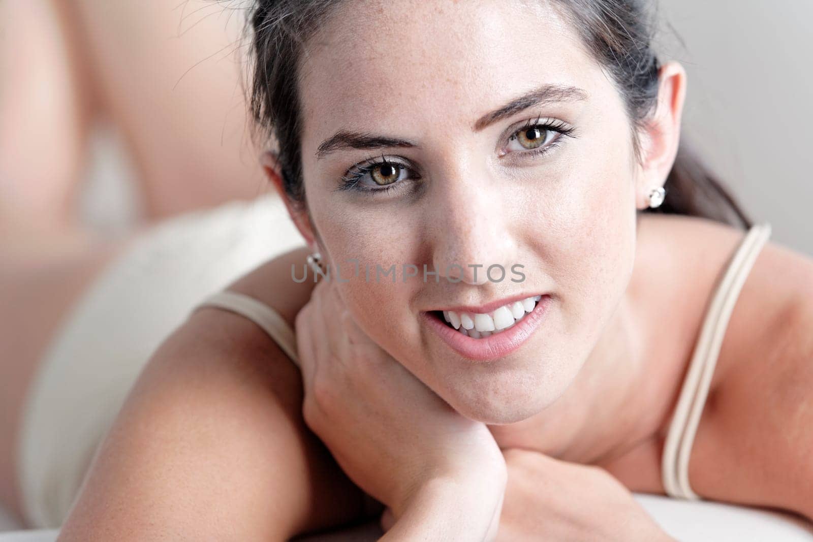 Sexy young woman in cream underwear