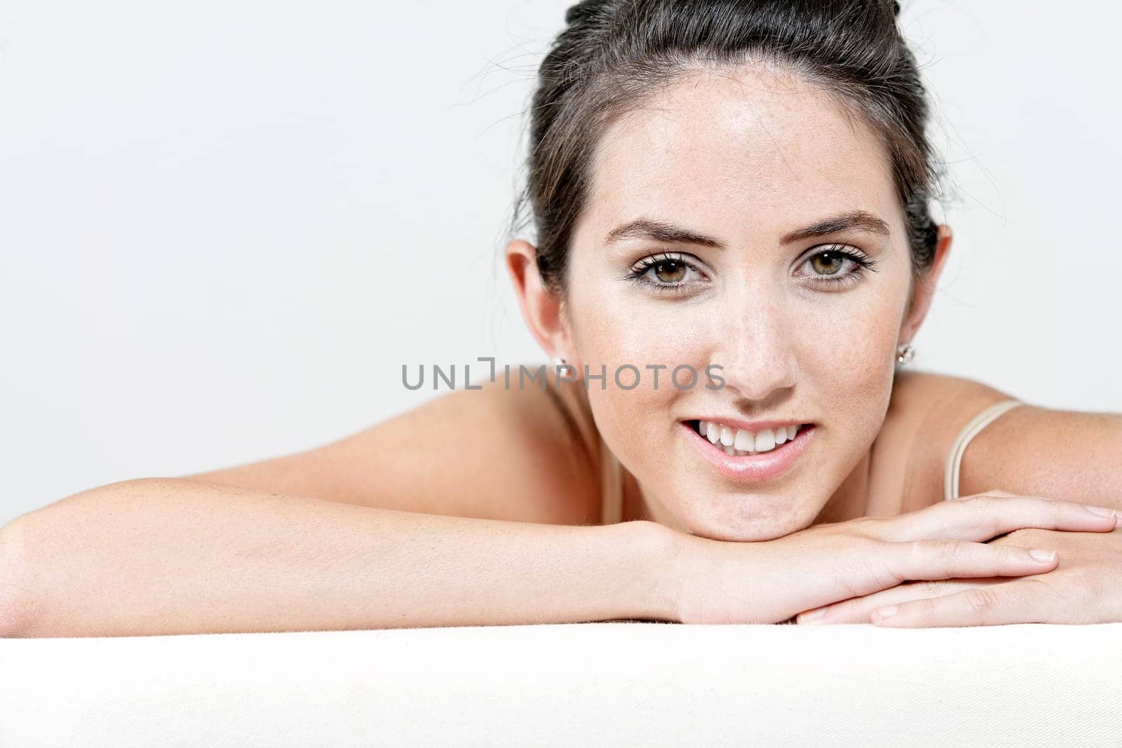 Sexy young woman in cream underwear