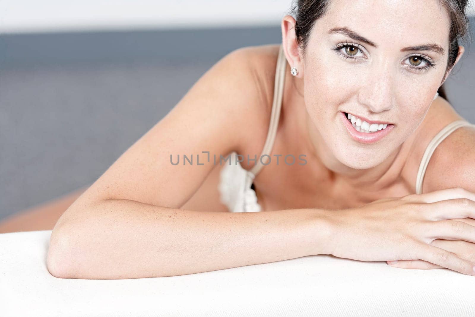 Sexy young woman in cream underwear