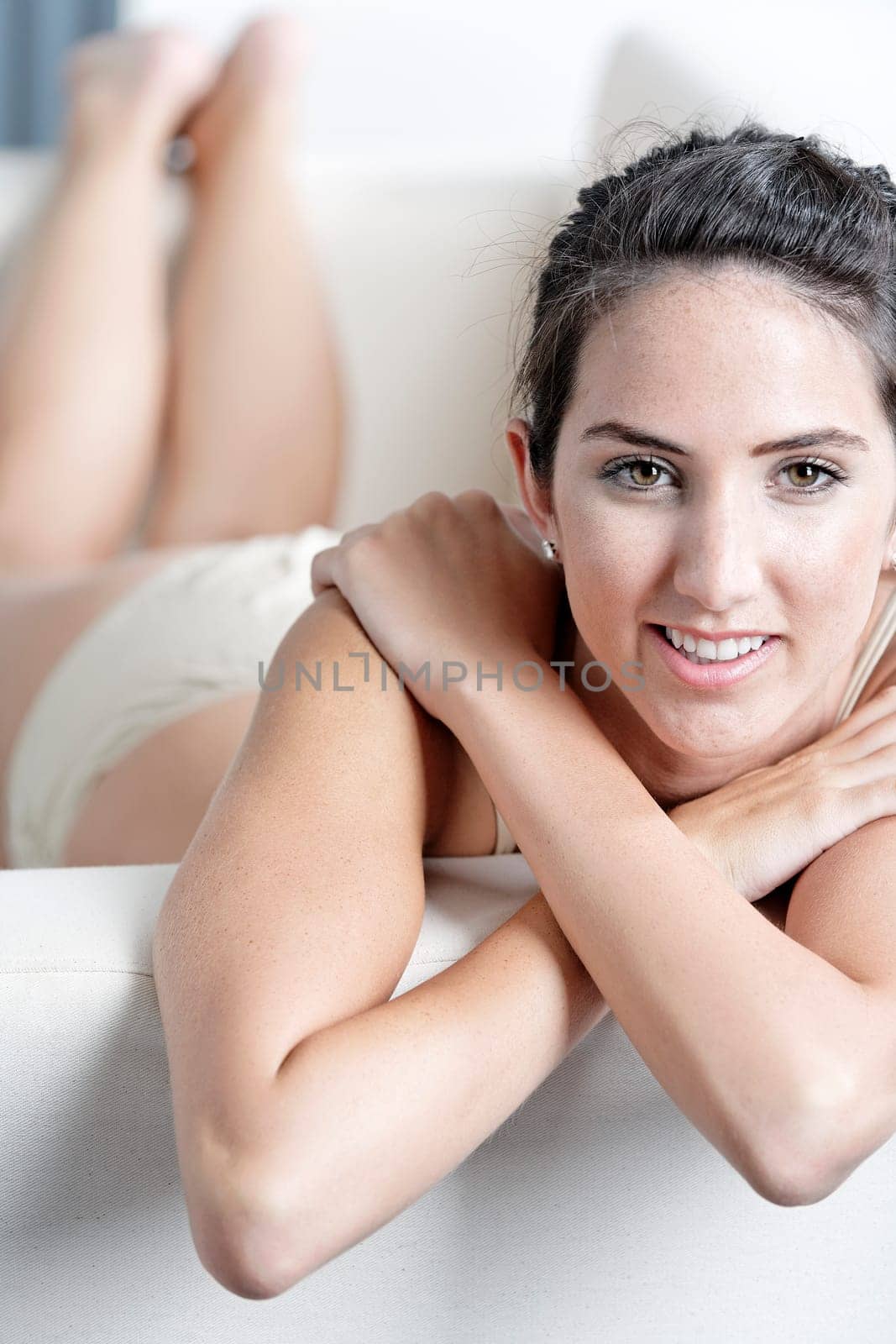 Sexy young woman in cream underwear