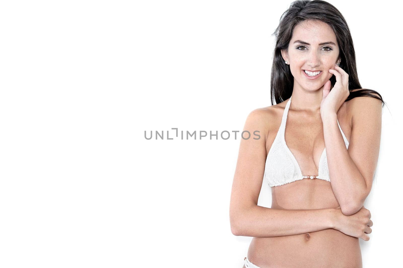Beautiful sexy woman in white bikini smiling and cheerful