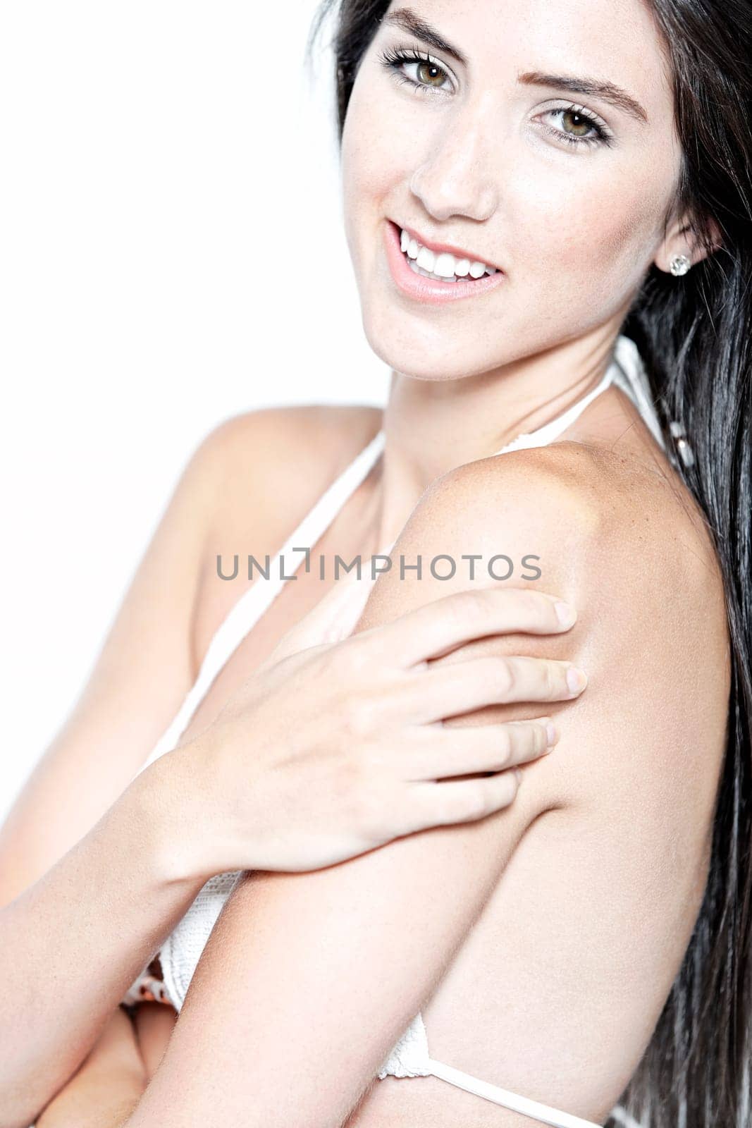 Beautiful sexy woman in white bikini smiling and cheerful
