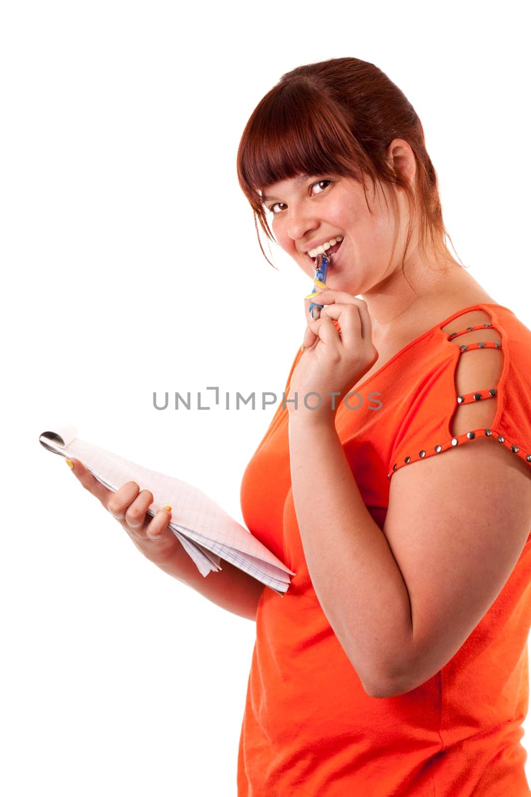 A college student takes notes for her homework. Isolated on white background