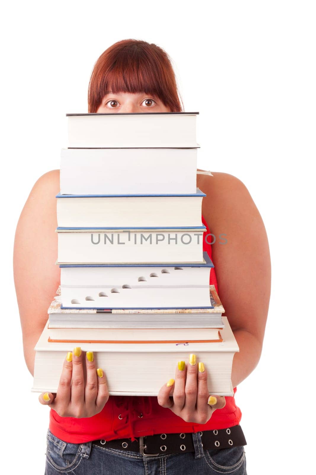 College student carrying a heavy stack of textbooks