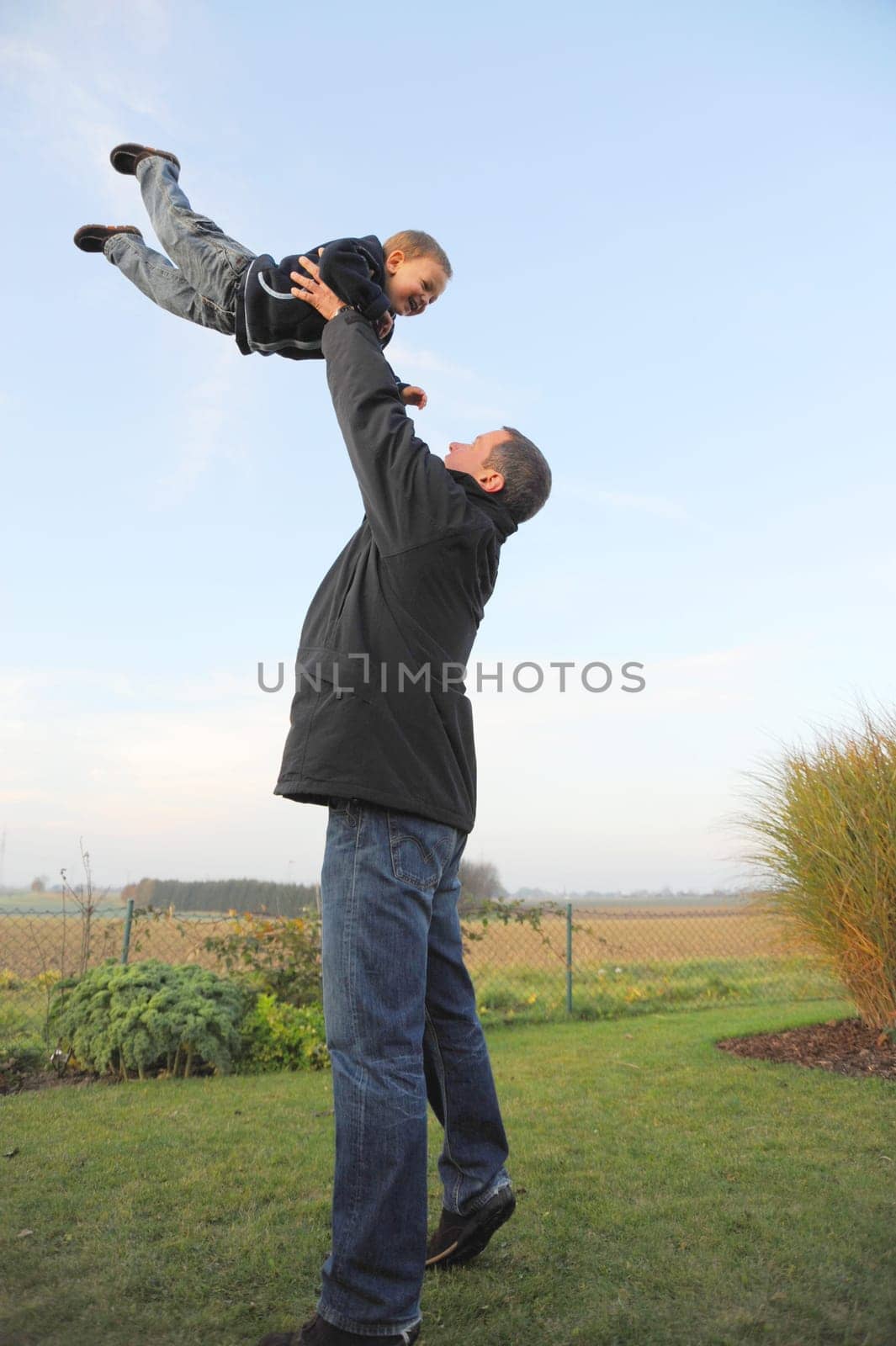 Family Fun - Father Throws Child in the Air -