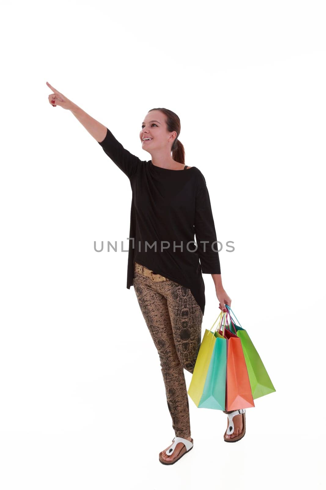 Young woman with colorful shopping bags isolated