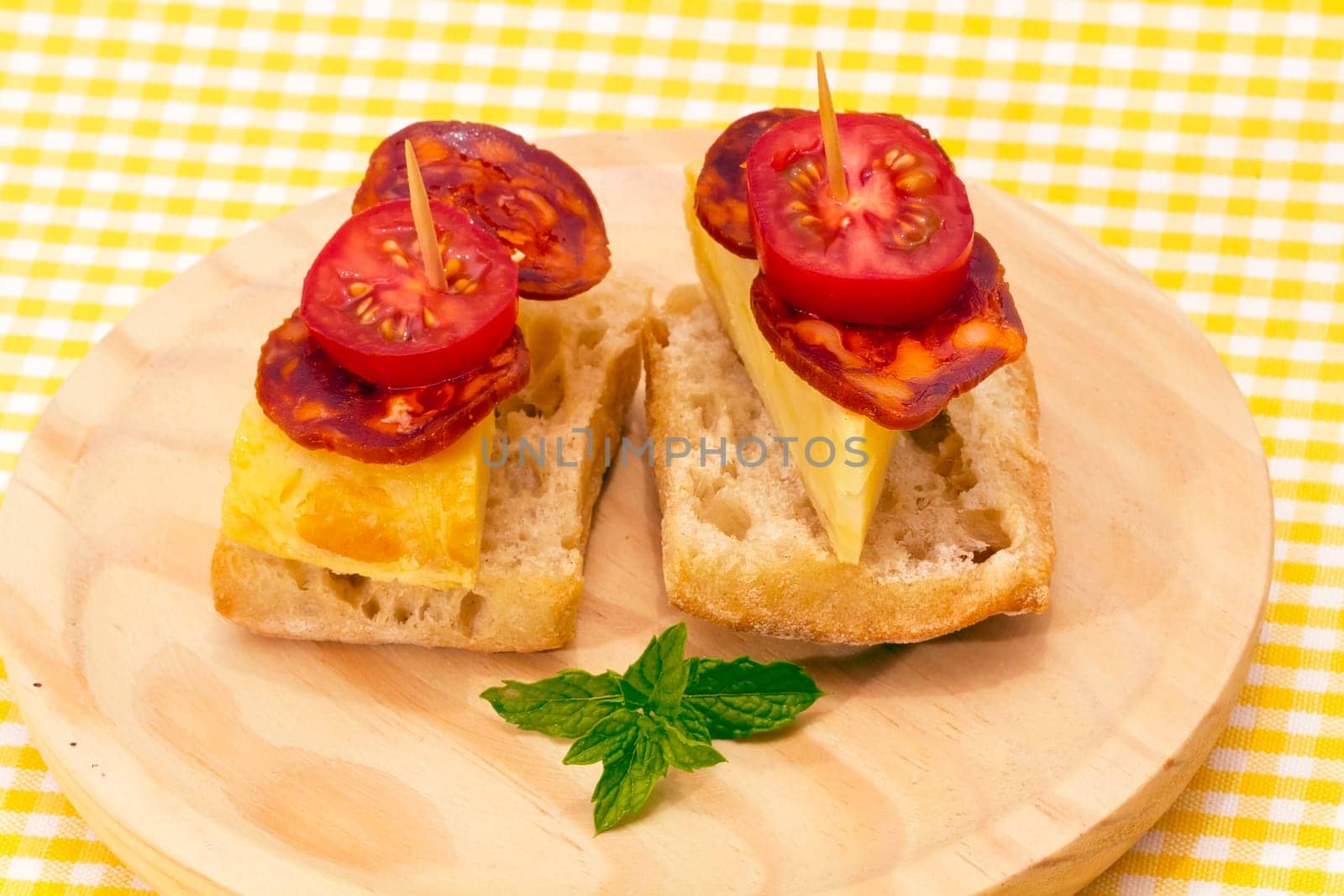 Spanish omelette with chorizo Iberico, typical cover montadito