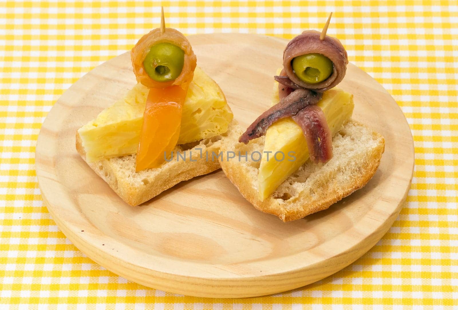 Delicious Appetizer Plate with Salmon, anchovies and Olives