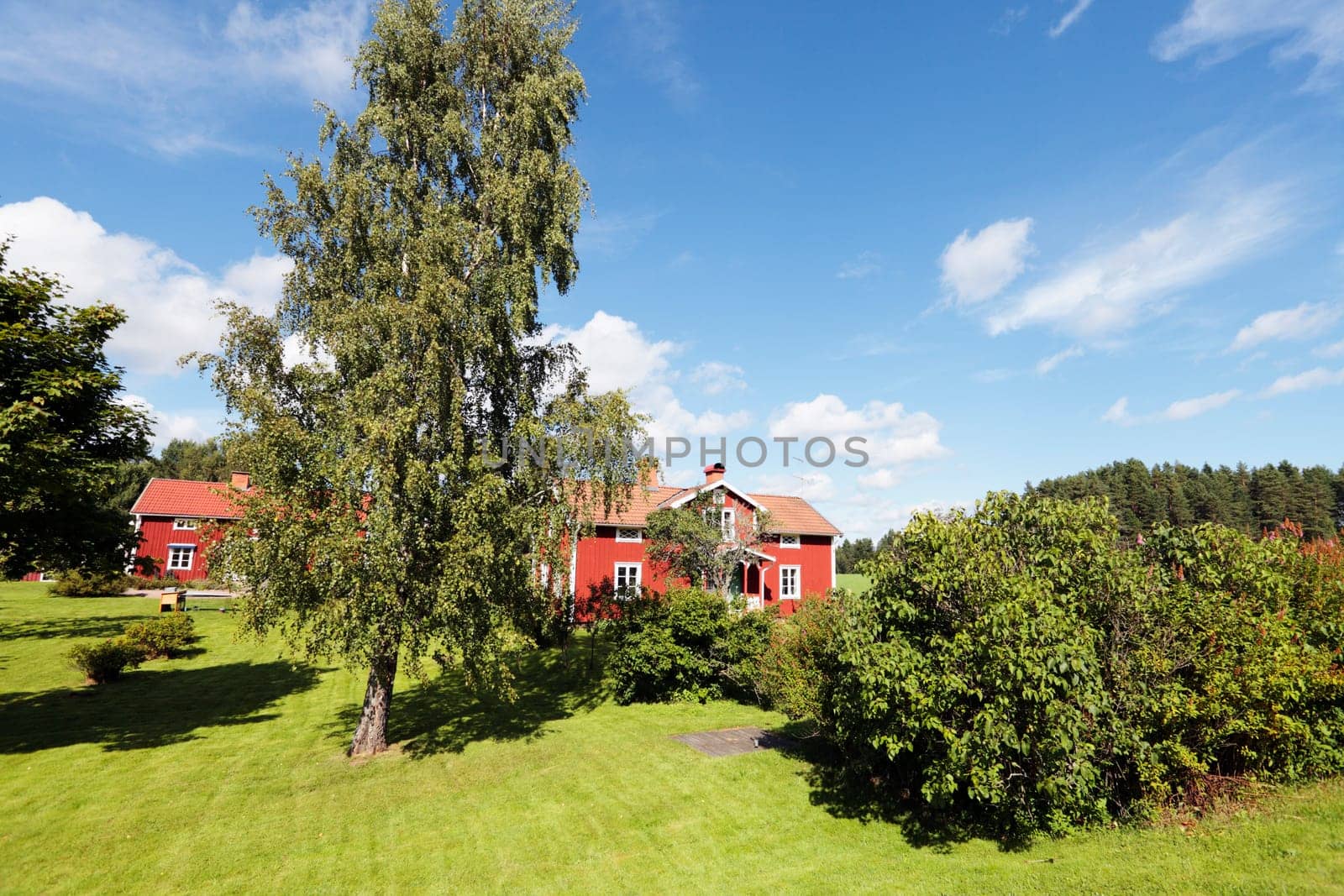 old red cottages, 16th century, typical swedish landscape scenery