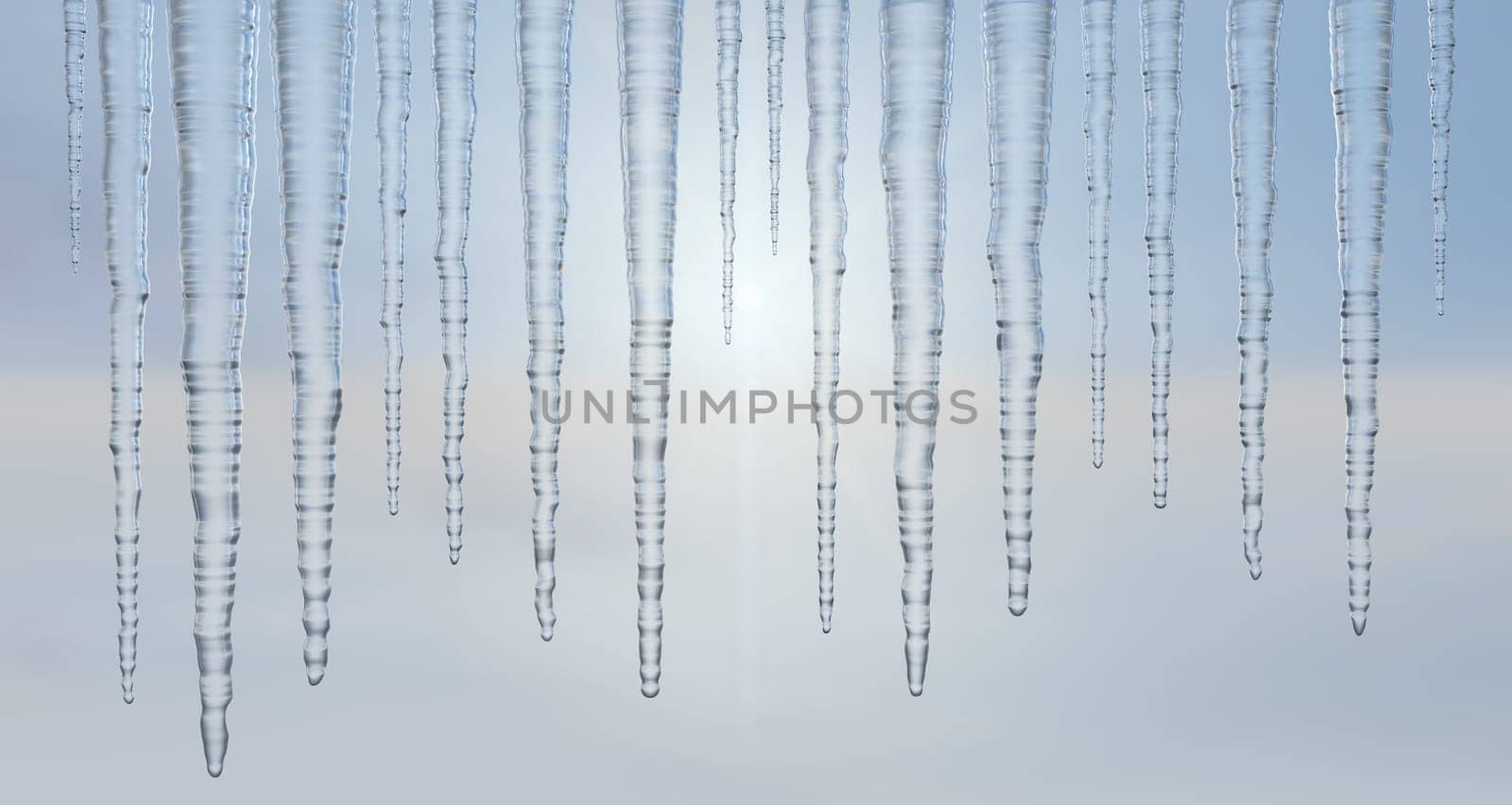 Icicles hanging outside against a hazy sky