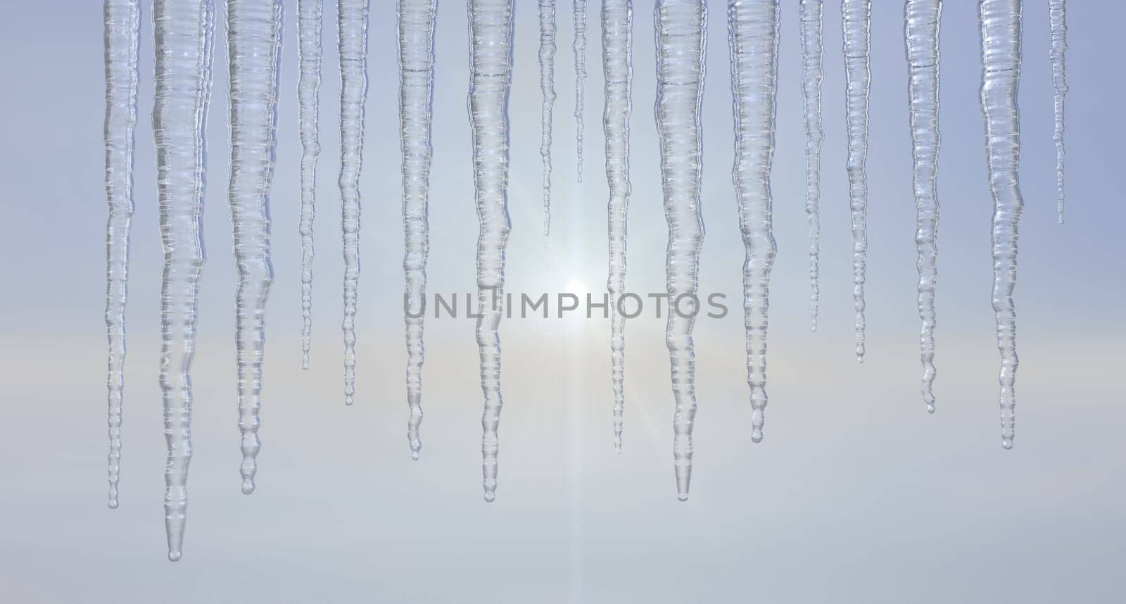 Icicles hanging outside against a hazy sky