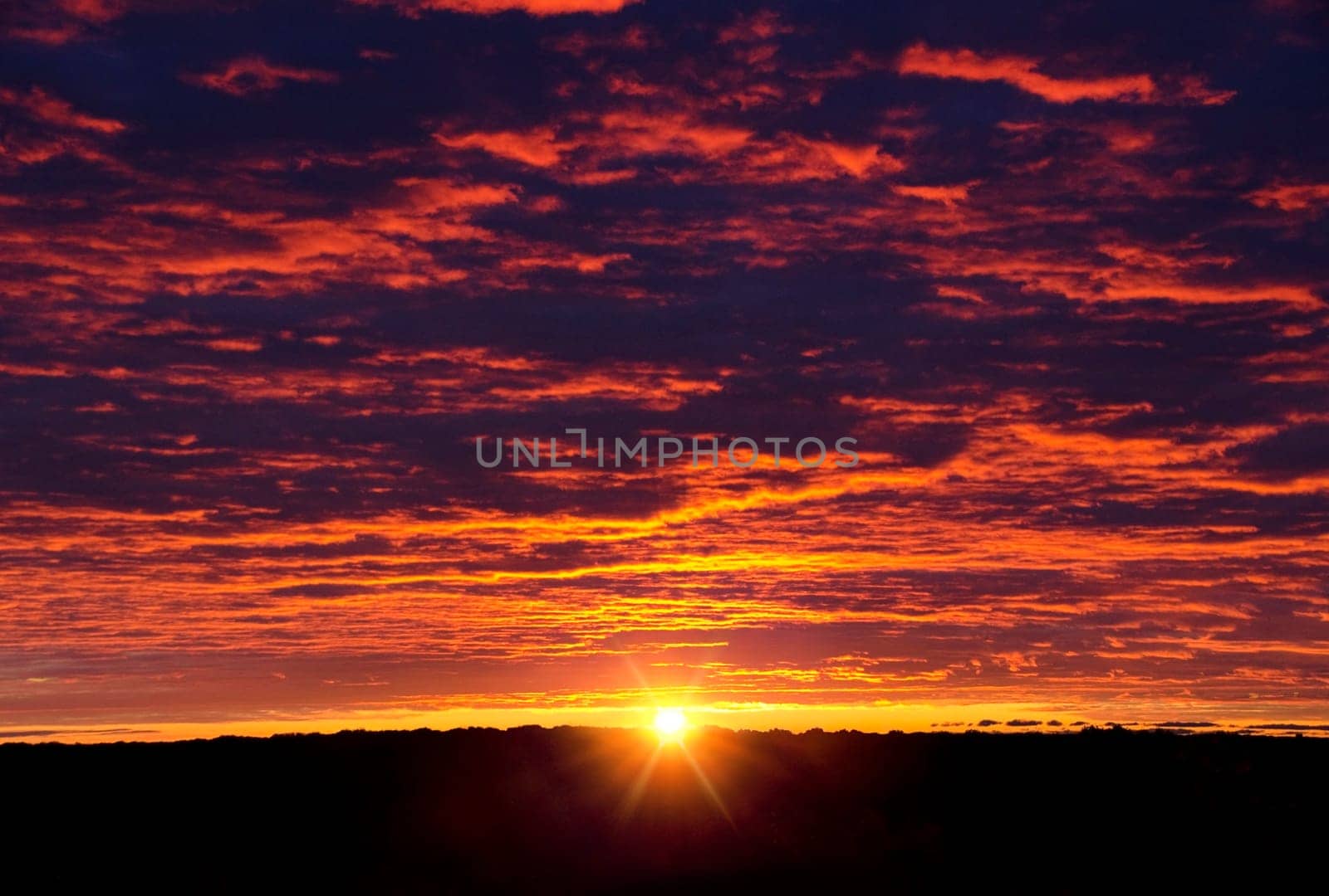 Fiery sunrise over Hennepin County, Minnesota looking from the highest point in Mound, Minnesota