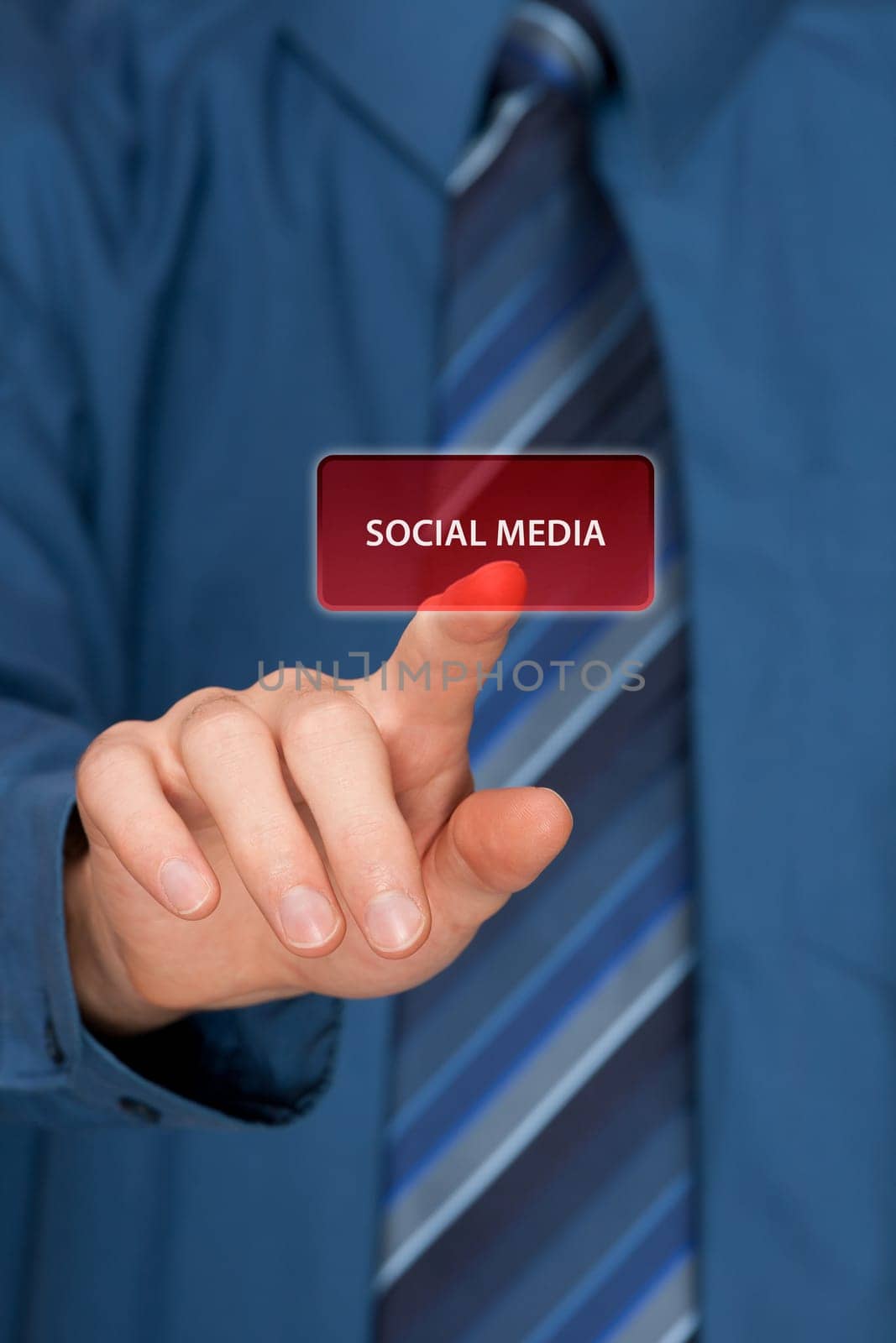 Social media concept. Mans hand click on social media button ahead. Selective focused hand.