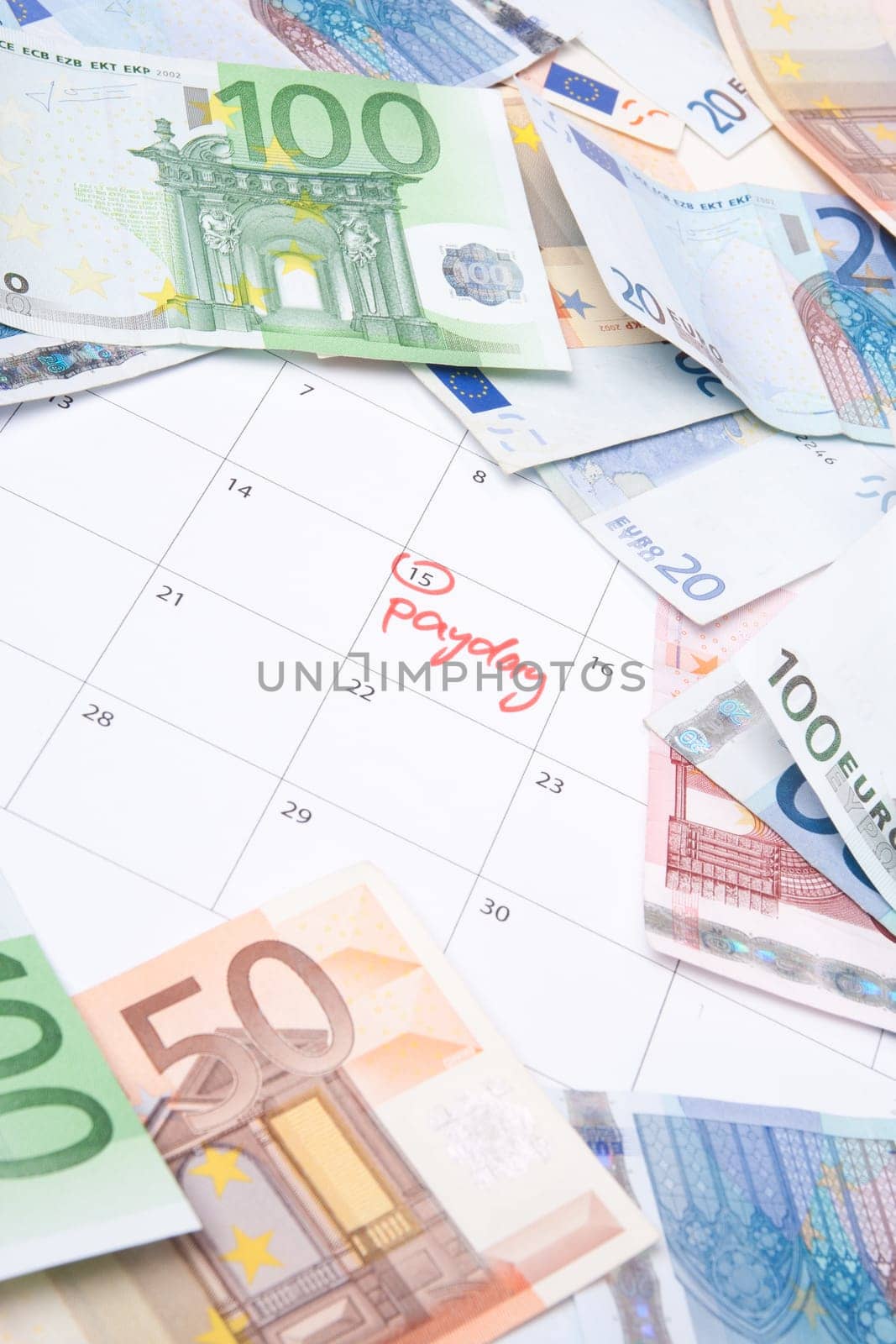 Payday concept - calendar wit text payday and money.