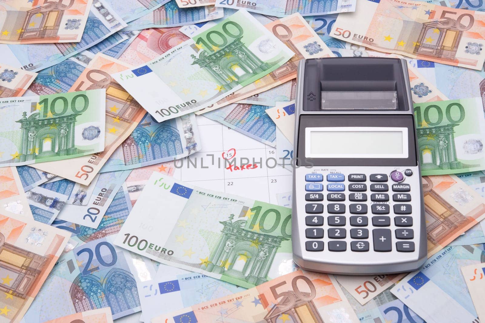 Calculator, money and calendar with taxes reminder.