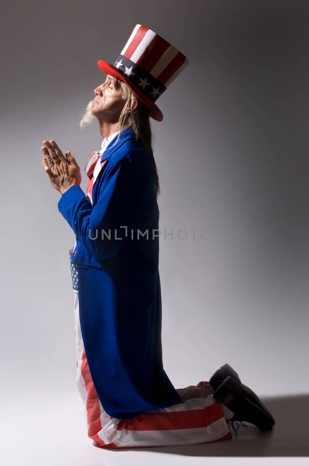 Uncle Sam kneeling in prayer