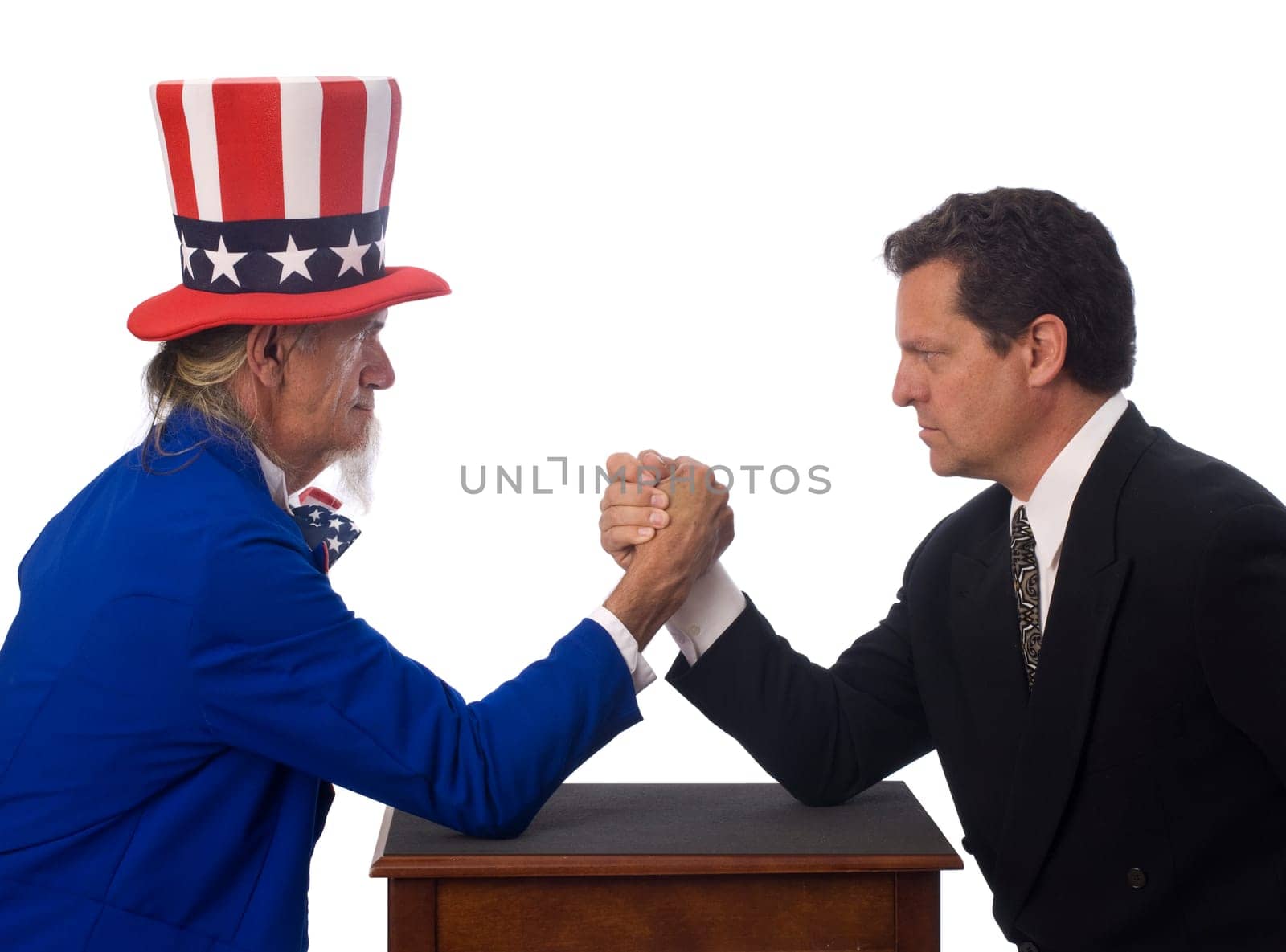 Uncle Sam arm wrestling with a businessman on a white background