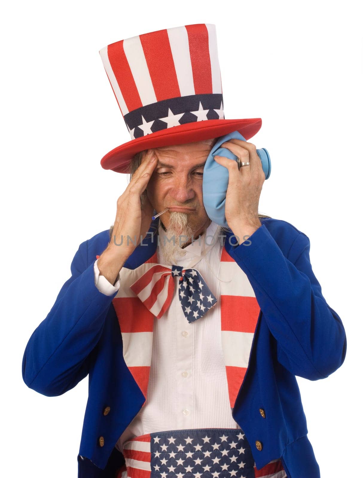 Uncle Sam feeling sick with an oral thermometer and an ice bag shot on a white background