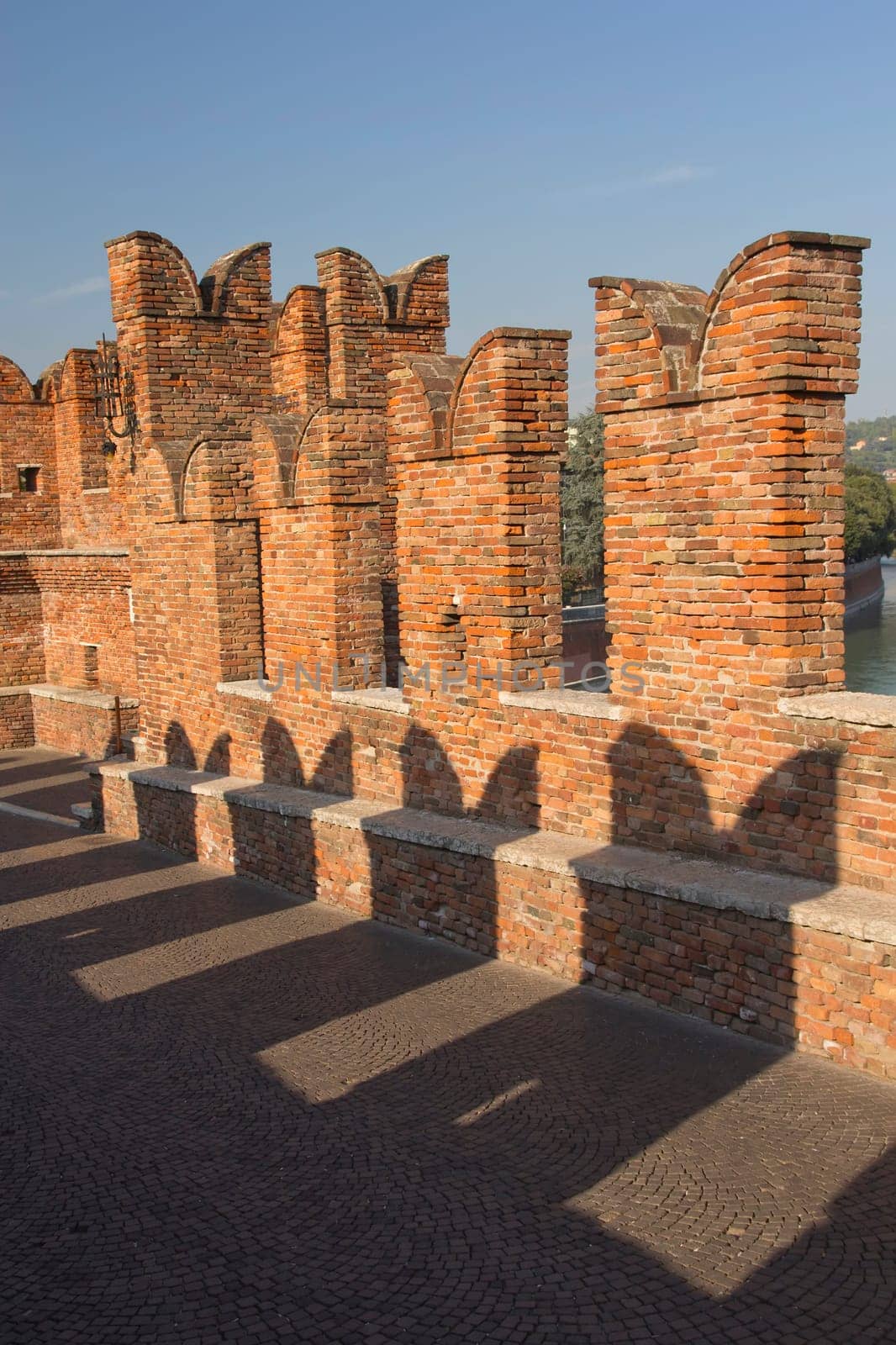 Detailed view of old brick bridge Ponte Scaligero in Verona (Italy). Vertically.