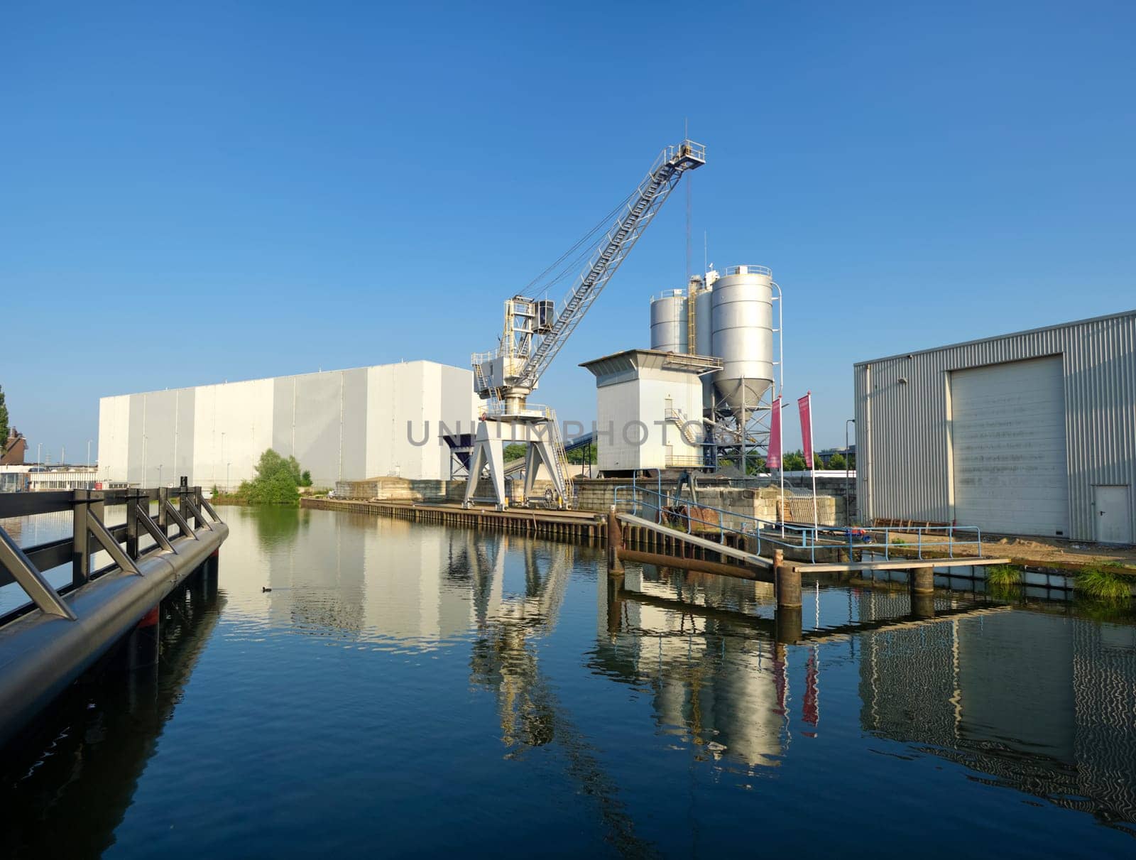 cement factory with crane and silos
