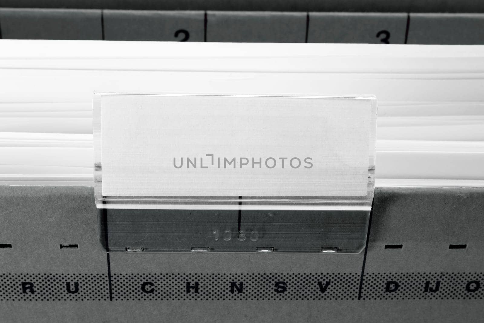 grey hanging file folder with blank label