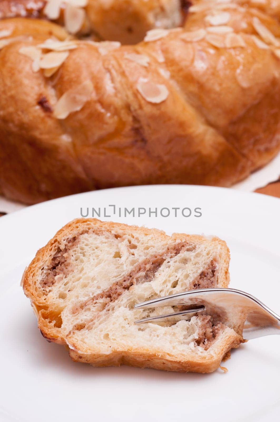 Nut cake with marzipan filling on a plate