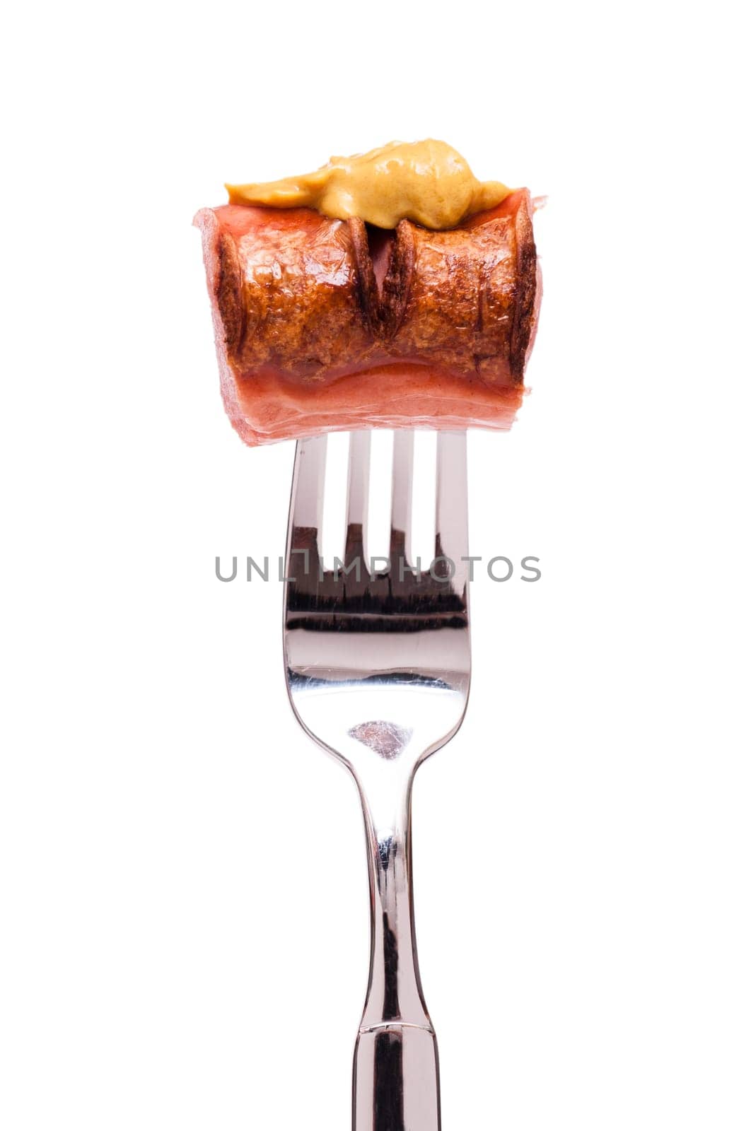 White insulated red sausage with mustard on a fork