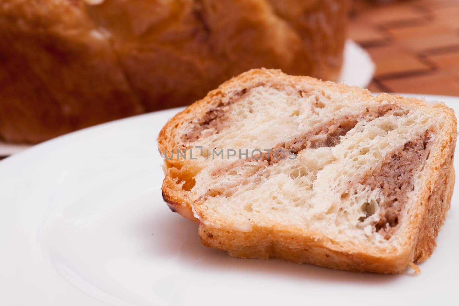 Close-up piece of nut cake on white plate