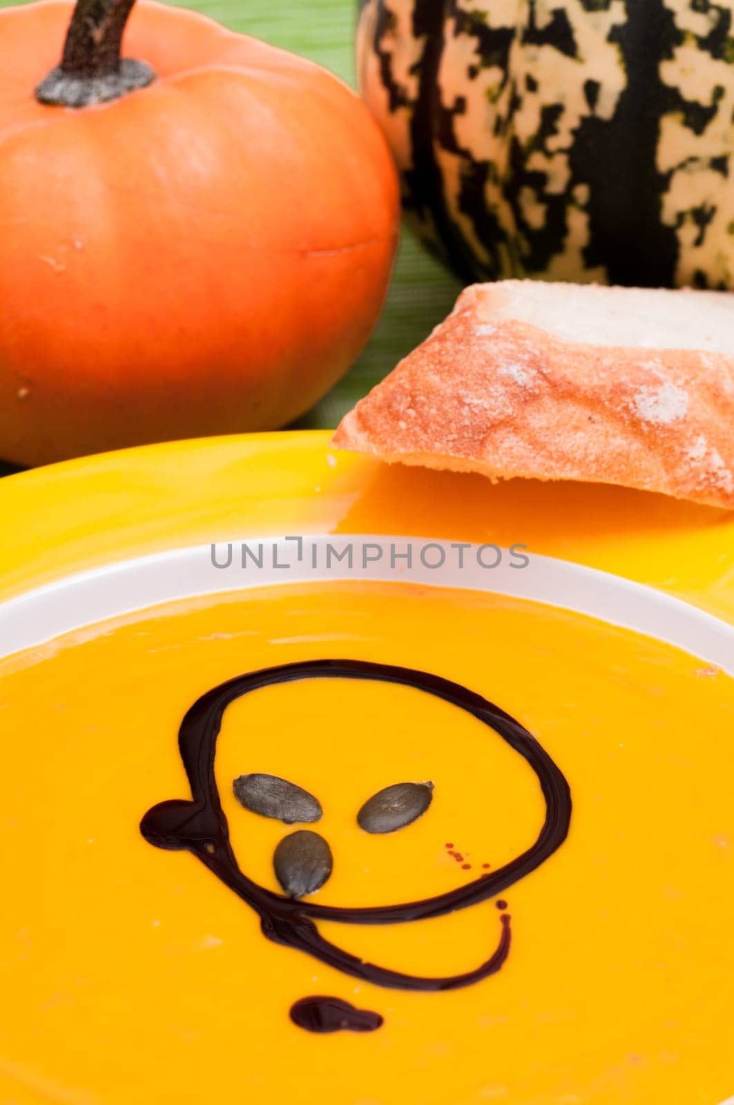 Pumpkin soup and pumpkin seeds with pumpkin seed oil