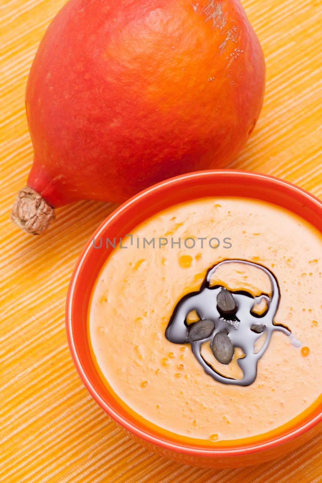 Pumpkin soup with pumpkin seed oil and pumpkin seeds