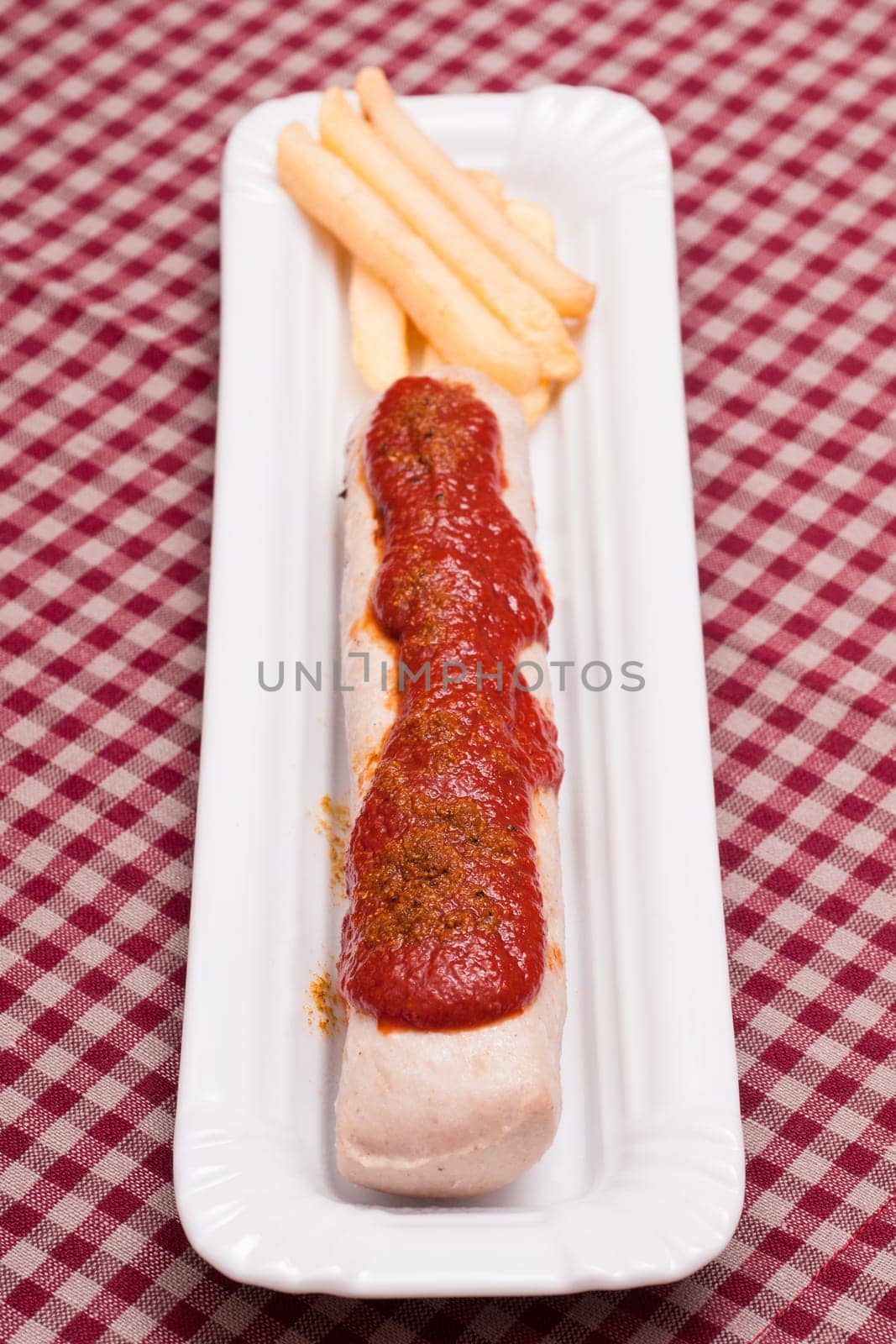 Oberland sausage as currywurst in portrait format