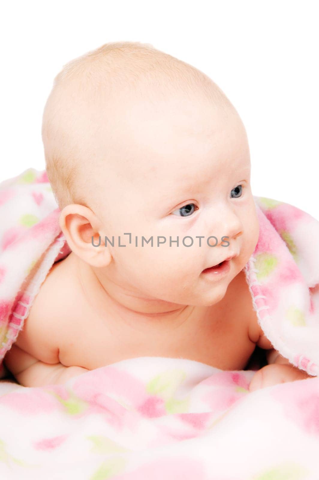 Little baby under multicolored towel