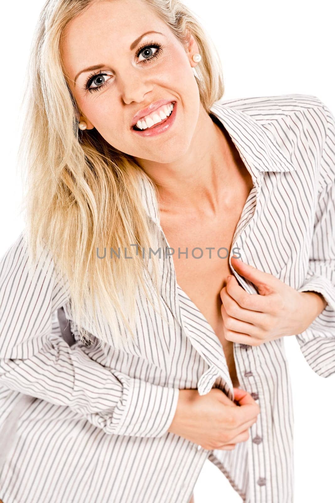Beautiful young woman in shirt and underwear on white background