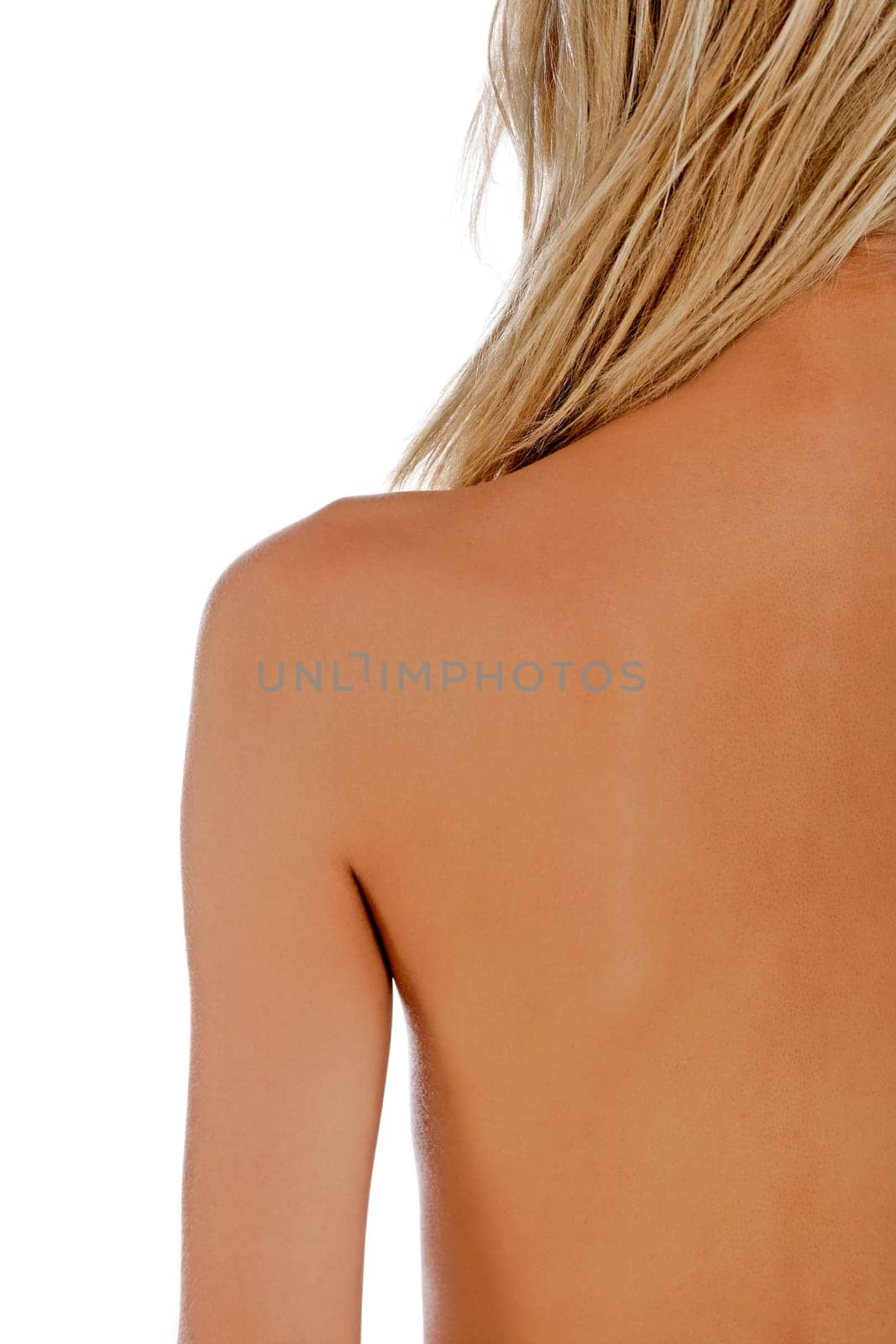 Attrative woman's back with blonde hair isolated on a white background
