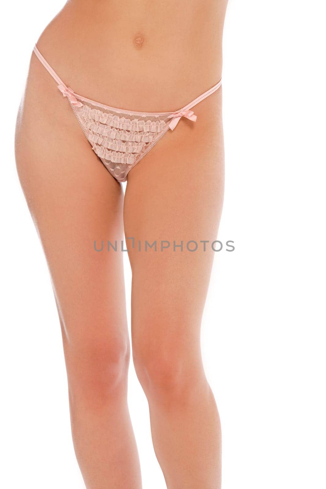 Attractive womans hips and upper legs in underwear and isolated on a white background