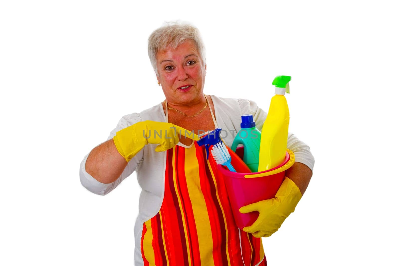 Senior woman with cleaning supplies - exposed on white background