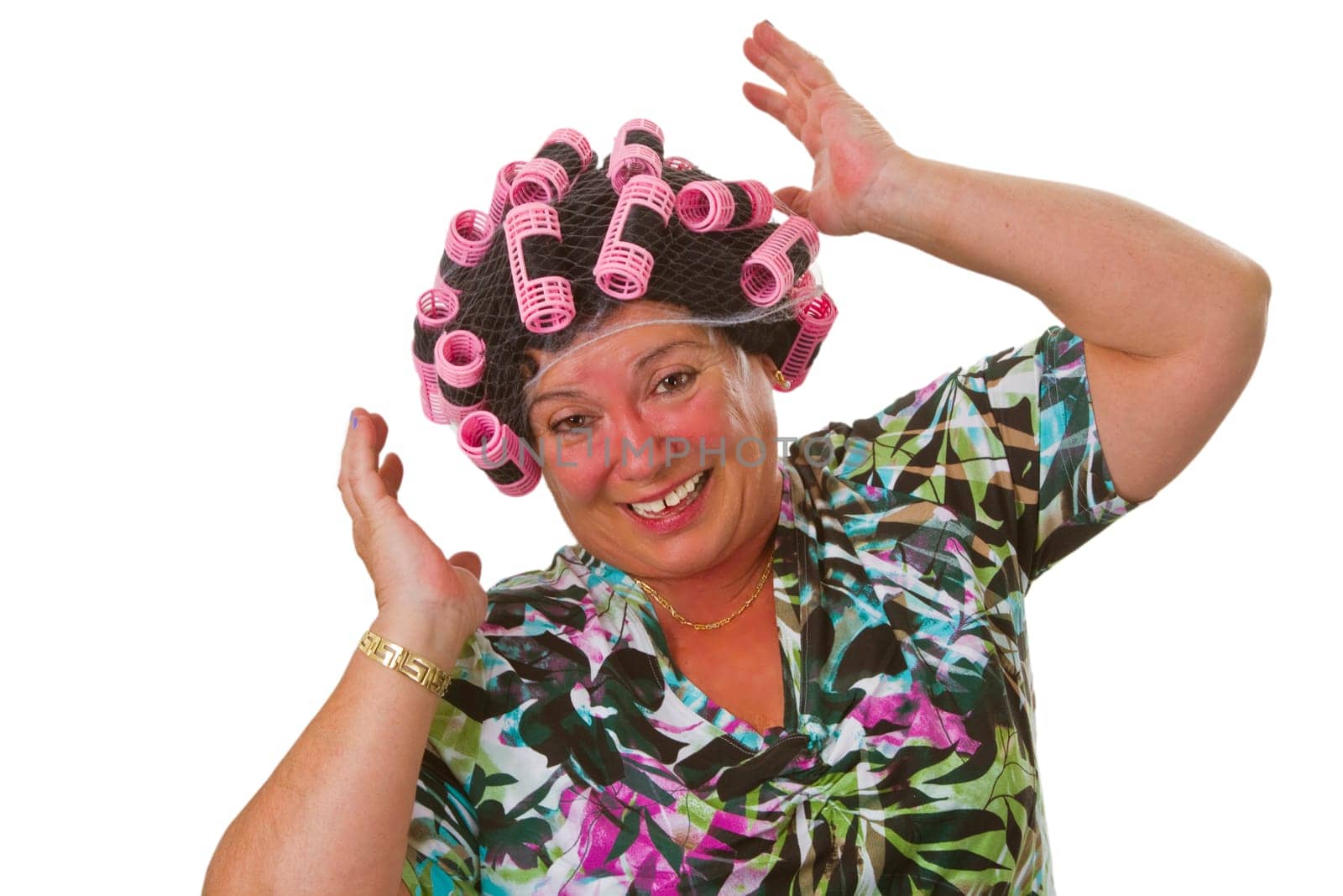 Senior woman with funny wig and curlers - isolated on white background