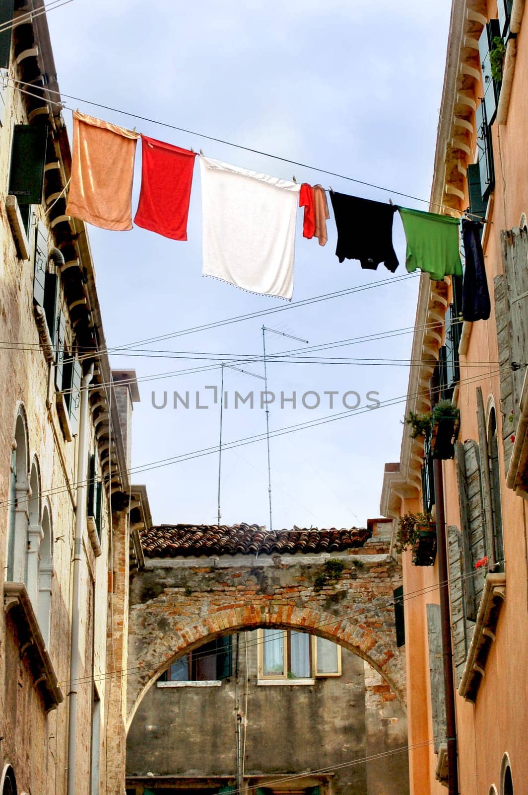 Fresh laundry hanging between two houses in venice