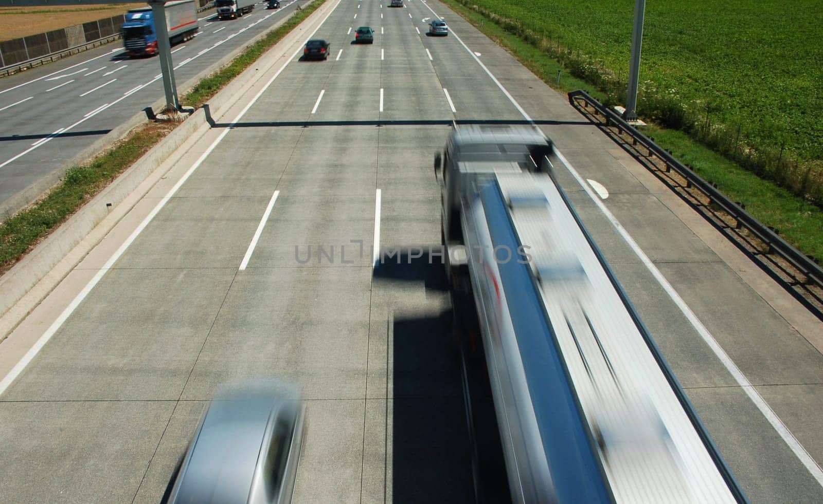 Truck and car in blurred motion on a highway