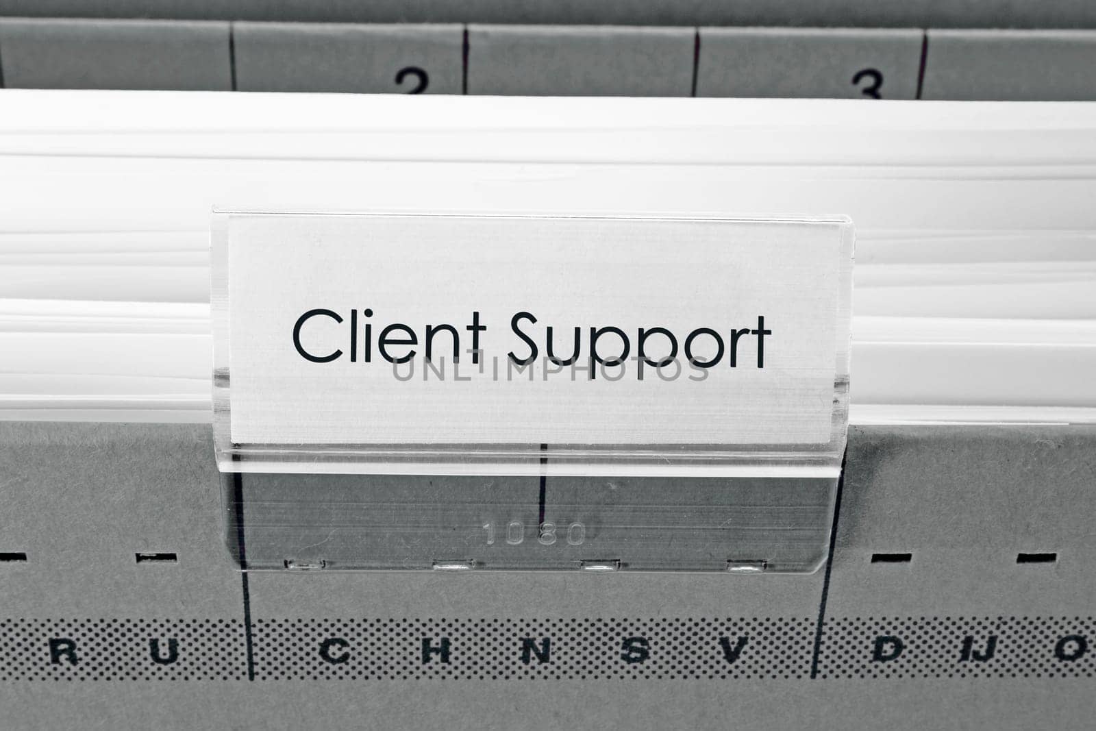 grey hanging file folder labeled with Client Support