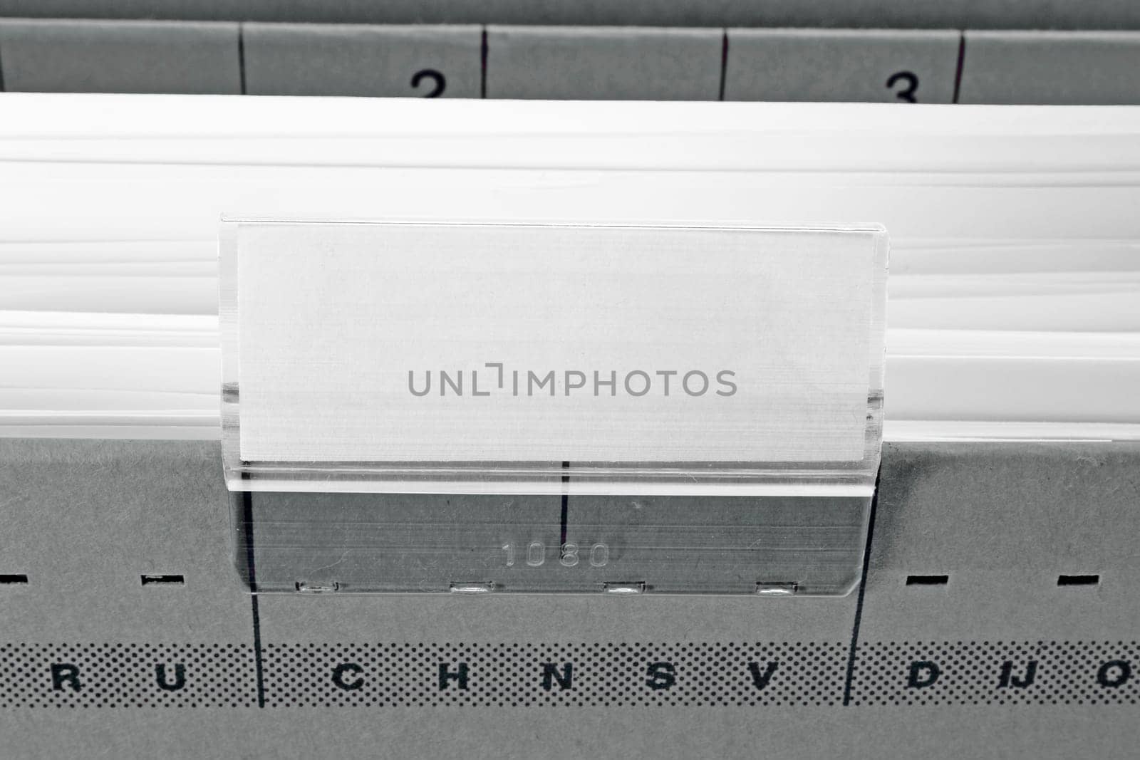 grey hanging file folder with blank label