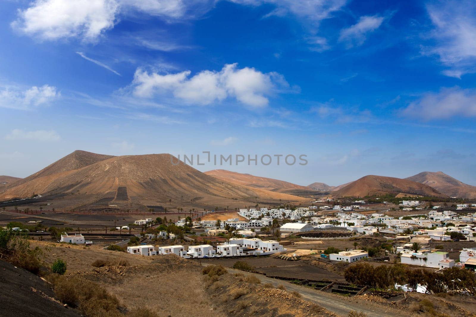 Lanzarote Yaiza white houses village under volcanic mountains of Canary Islands