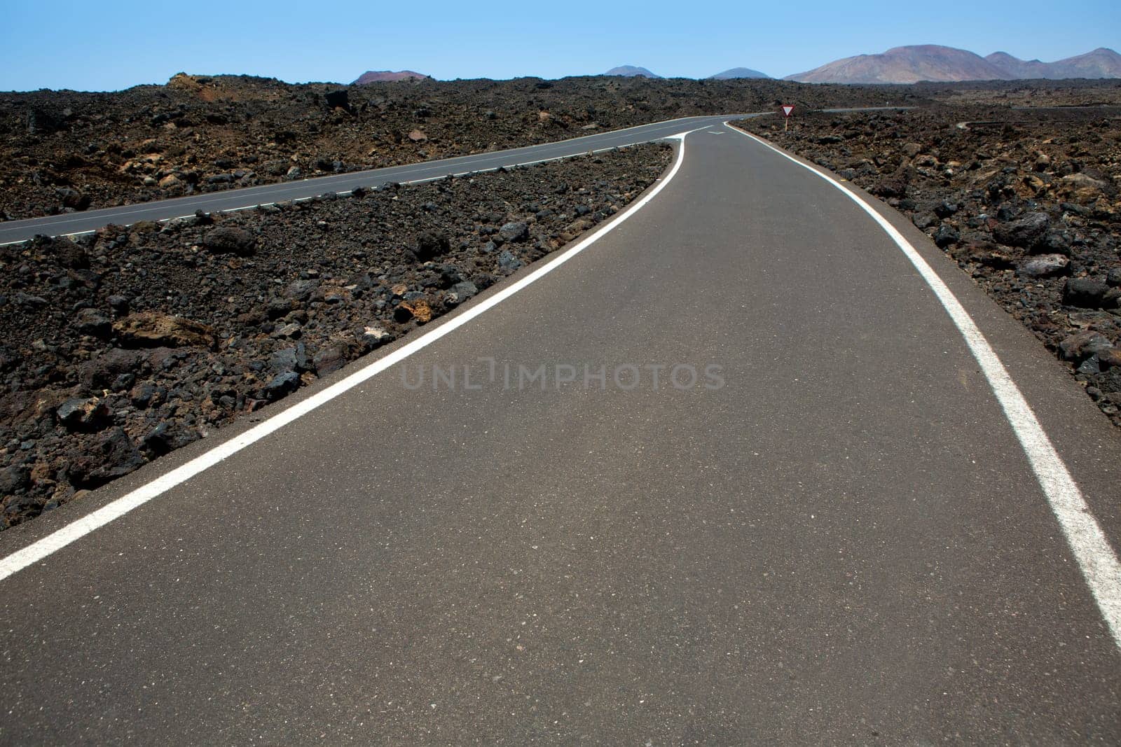 Black volcanic soil and road detail in Lanzarote Canary Island