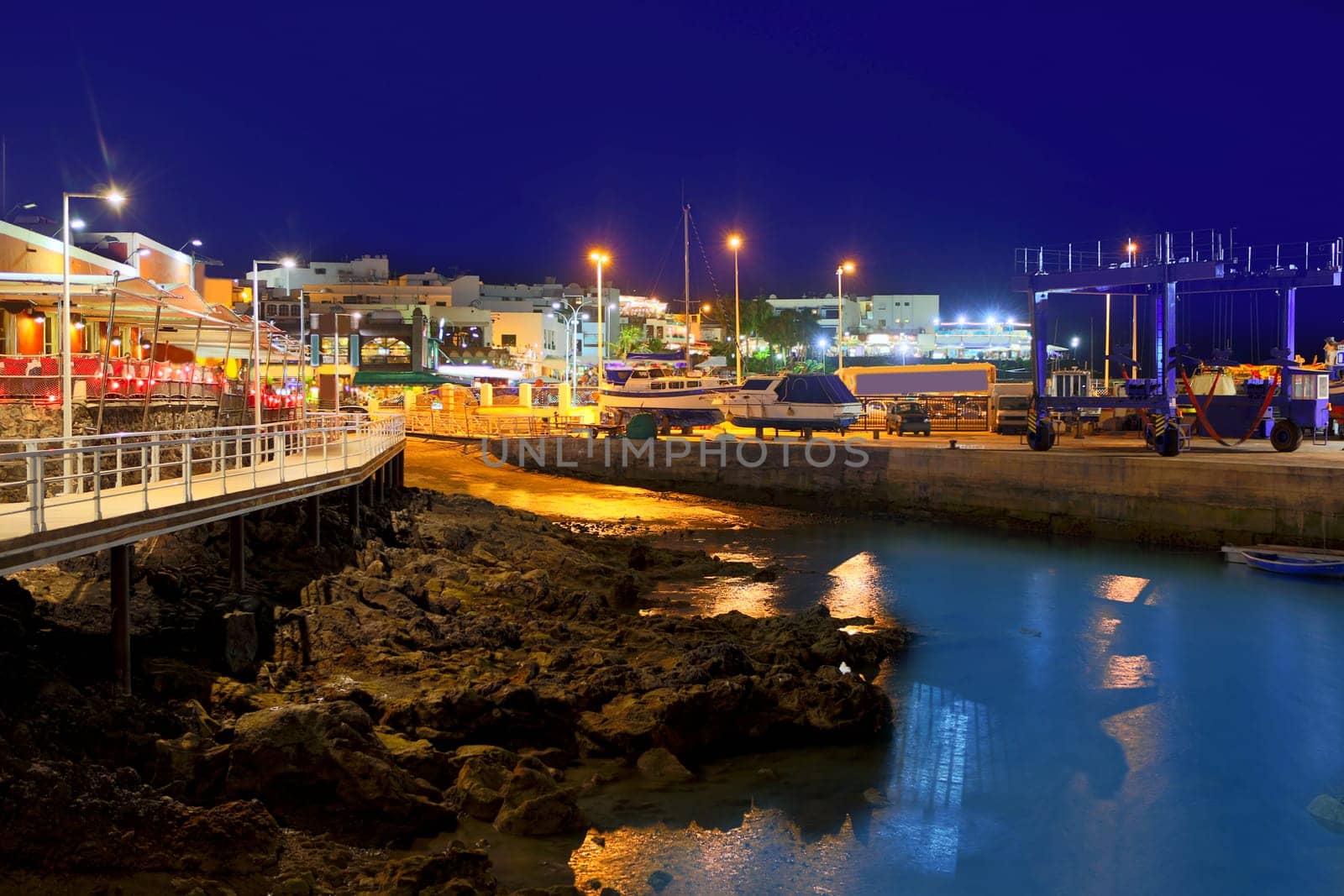 Lanzarote Puerto del Carmen harbour night view in Canary Islands