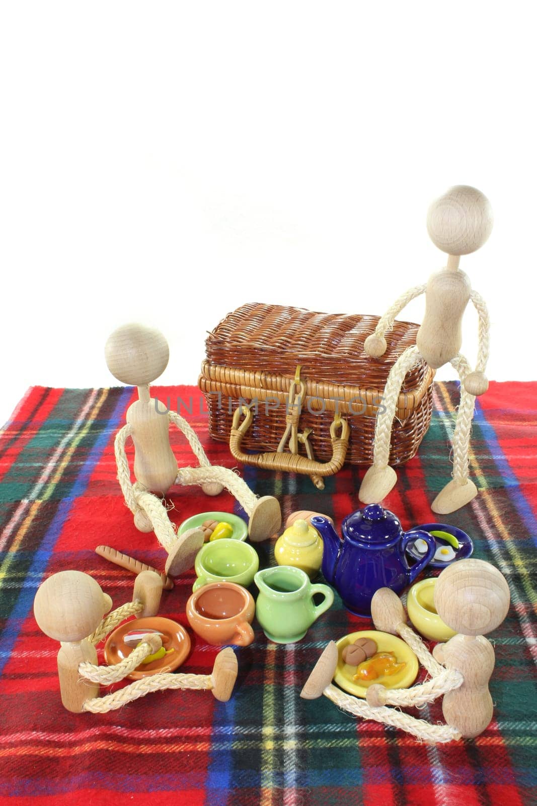 A small family on a blanket having a picnic